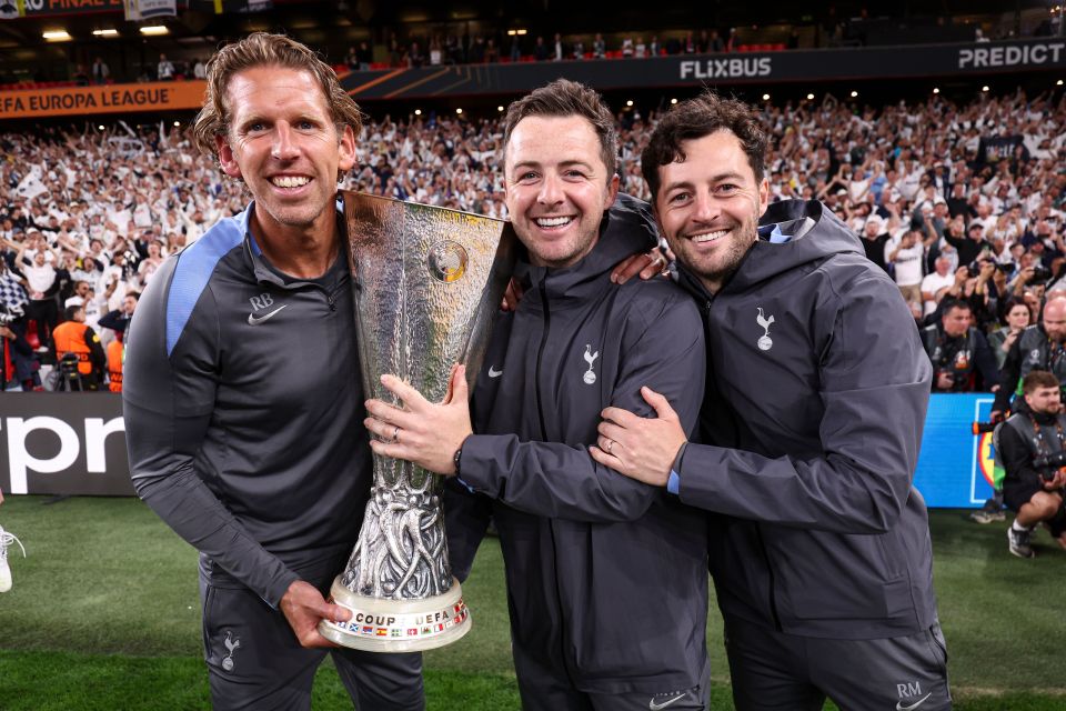 Rob Burch, Matt Wells, and Ryan Mason with the Europa League trophy.