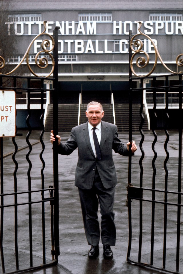 Bill Nicholson, manager of Tottenham Hotspur, stands in the gates of White Hart Lane.