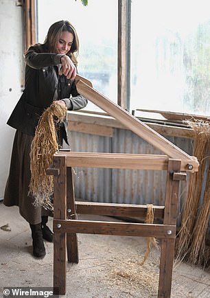 The Princess of Wales uses a restored heritage machine that is used for 'breaking and scutching' during her visit to Mallon Farm
