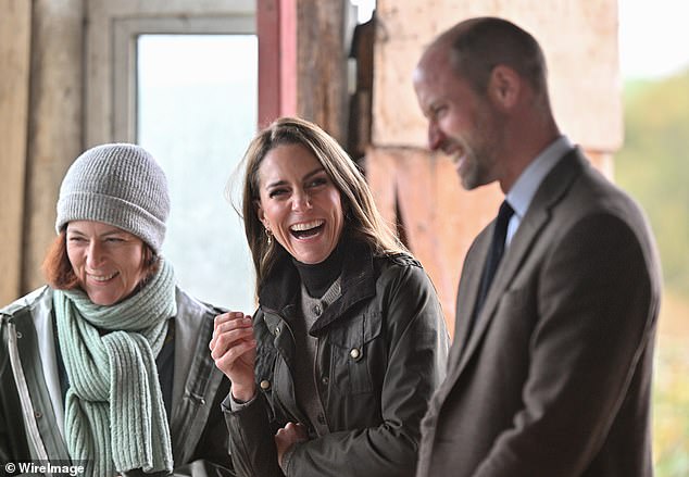 The Prince and Princess share a laugh with Helen Keys (L) during their visit to Mallon Farm
