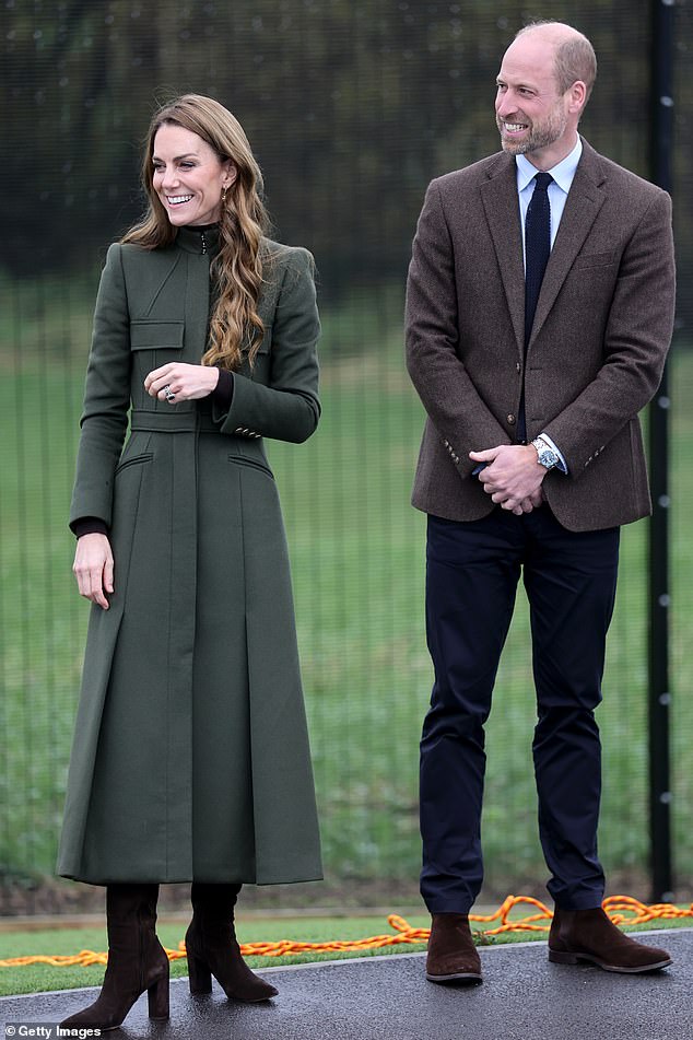 Kate looked typically sophisticated in her midi coat which she teamed with brown boots