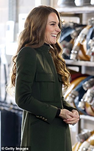 The beaming Princess styled her hair into glamorous curls for the day-long trip to Northern Ireland