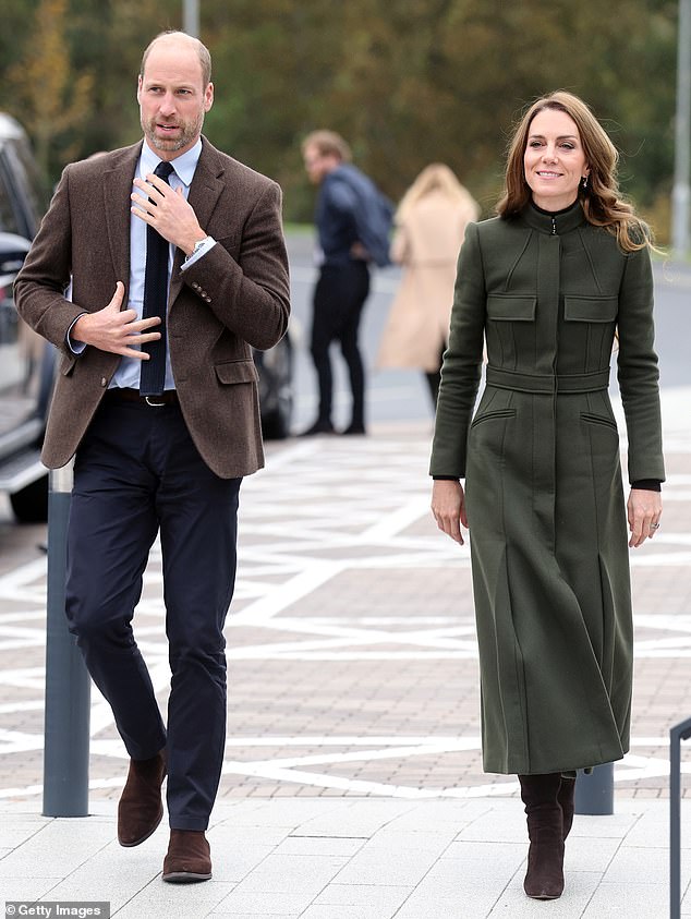 William put on a dapper display in a pair of navy trousers teamed with a stylish brown blazer and light blue shirt as he arrived alongside Kate