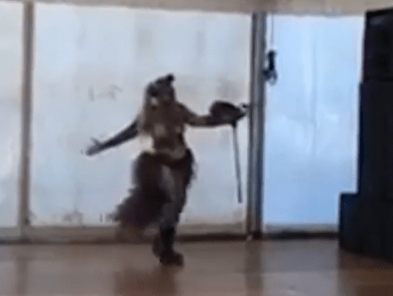 Person in costume dancing.