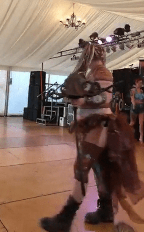 Person in costume walking.