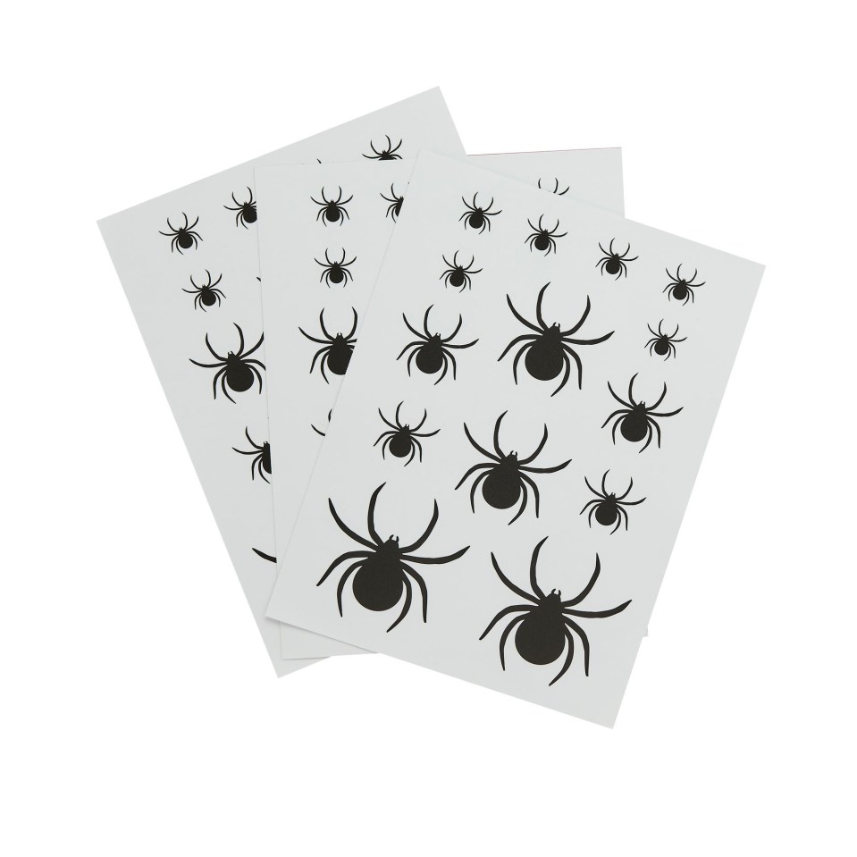 Illustration of white sheets with black spider decals in various sizes.