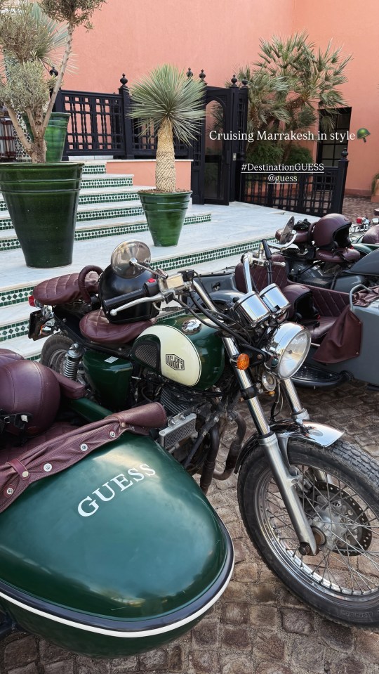 Motorcycle and sidecar, branded "Guess", parked outside La Mamounia hotel in Marrakesh.
