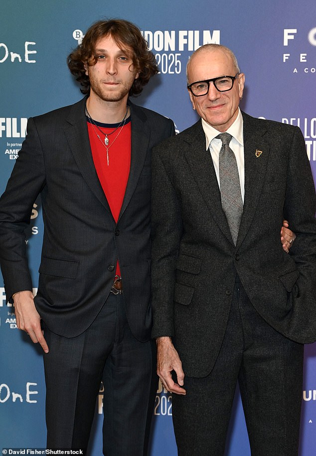 The actor, 68, cut a dapper figure for the event in a black suit which he wore with a white shirt and grey tie