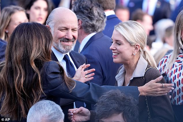 Agriculture Secretary Brooke Rollins, left, greets Attorney General Pam Bondi, as Commerce Secretary Howard Lutnick looks on, before President Donald Trump arrives to present the Presidential Medal of Freedom for Charlie Kirk