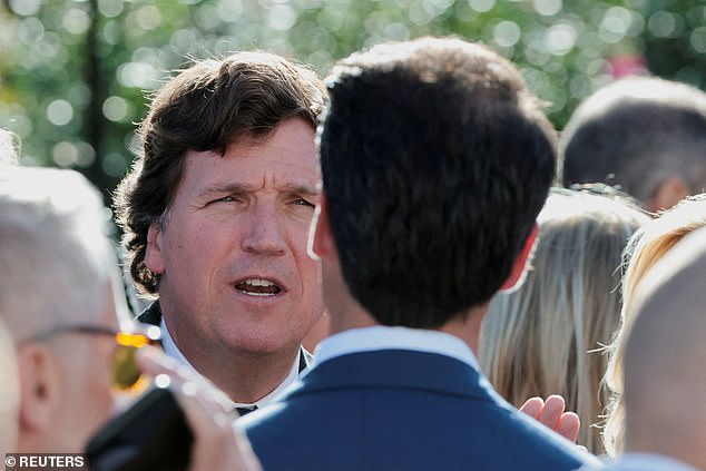 Political commentator Tucker Carlson attends a ceremony held by U.S. President Donald Trump to posthumously award the Medal of Freedom to Charlie Kirk
