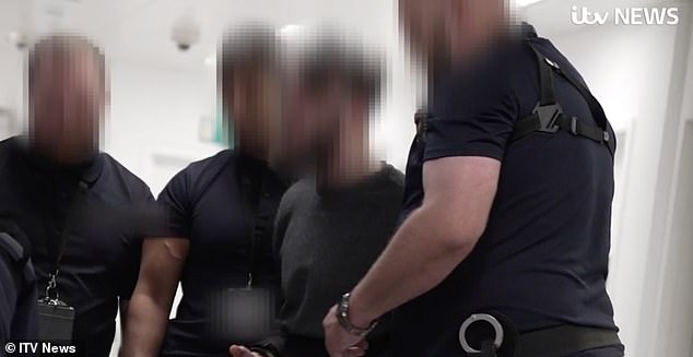 One particularly aggressive deportee had to be fitted with arm restraints