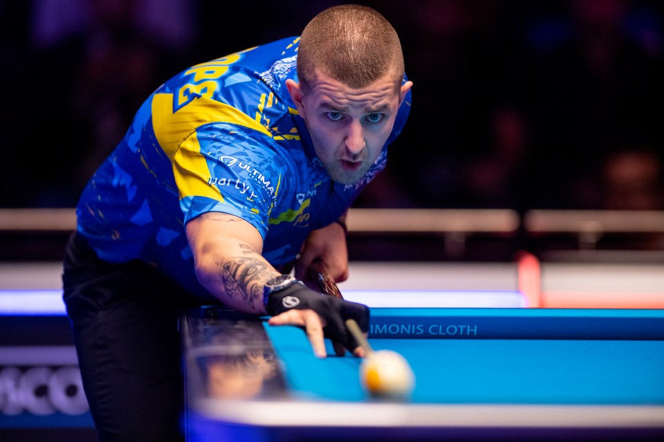 Jayson Shaw of Team Europe playing a shot in a game of pool.