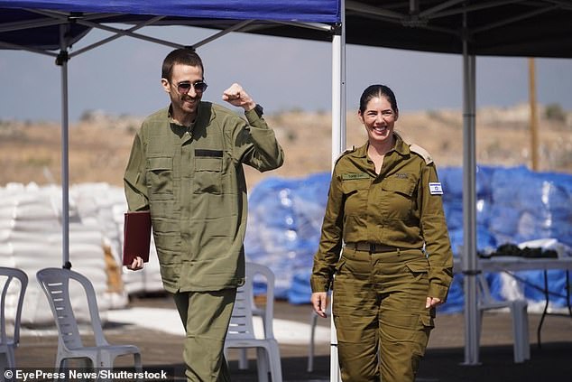 Released hostage Avinatan Or is seen meeting with an IDF officer in the Gaza Strip shortly after being freed from Hamas captivity on October 13, 2025