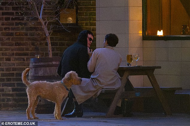 As their wider circle of friends drifted away, the pair were seen chatting alone outside the London watering hole