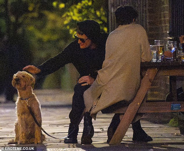 Matt petted Katie's dog, which sat obediently by her side during the outing on Sunday