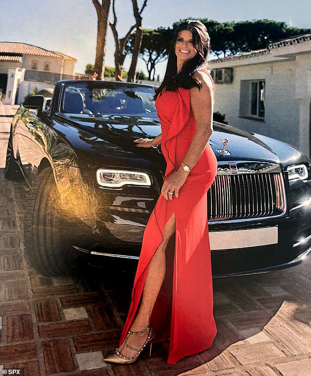 Nicola Morrissey, the moll of Kinahan Cartel mobster 'Johnny Cash' Morrissey, posing beside a £350,000 Rolls-Royce Dawn