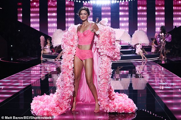 Gigi flashed her taut midriff in a bubblegum-pink top and high-waisted lace panties