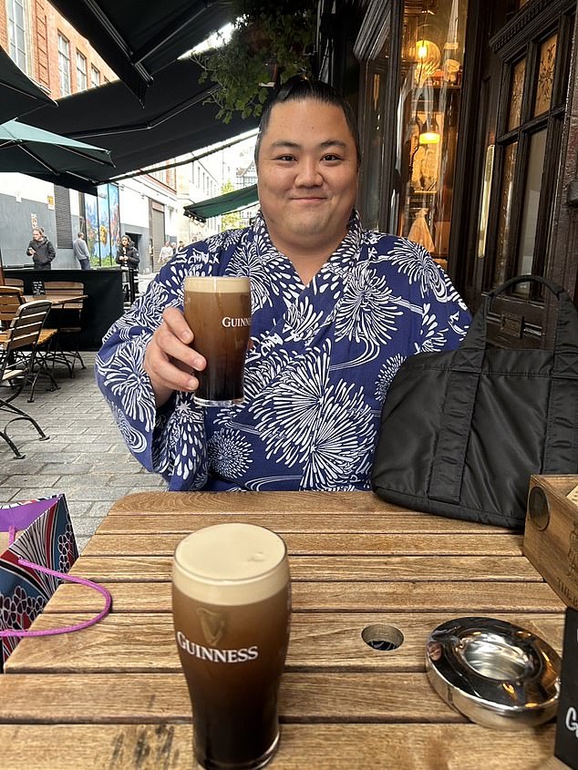 One sumo star enjoys a pint of Guinness in London while exploring the city