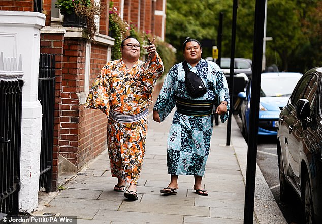Sumo wrestlers on a walk in Kensington ahead of the Grand Sumo Tournament, which started on Wednesday evening at the Royal Albert Hall
