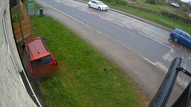 A car can be seen in another clip bouncing between waiting traffic at the junction, only to veer off the road and come to a stop ¿ just inches from a bus stop