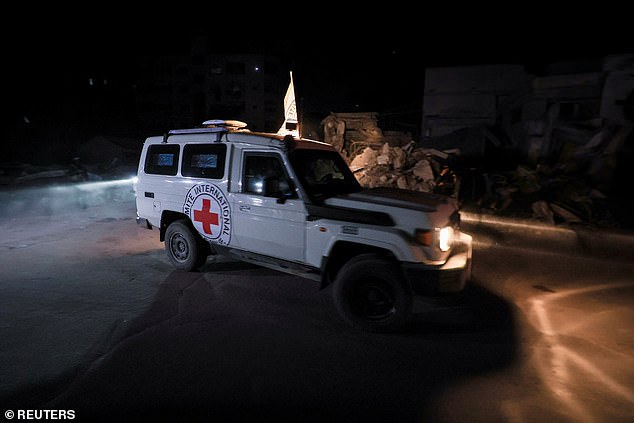 A Red Cross vehicle transports the bodies of hostages who were held in Gaza since the deadly October 7, 2023, attack, after they were handed over by Hamas militants as part of a ceasefire and a hostage-prisoner swap deal between Hamas and Israel, in Gaza City, October 15
