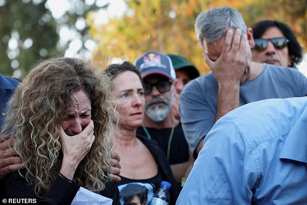 Doris Liber and Michel Iluz, the parents of Israeli hostage Guy Illouz mourn during his funeral in Raanana, Israel October 15, 2025