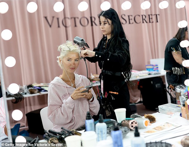 She looked amazing wearing the iconic pink satin striped rope which she donned over a pink bra by the brand