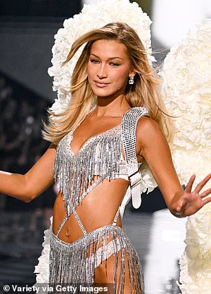 The bra was connected to her garter, which also was decorated with the sequined tassel and had thin straps crisscrossing her stomach