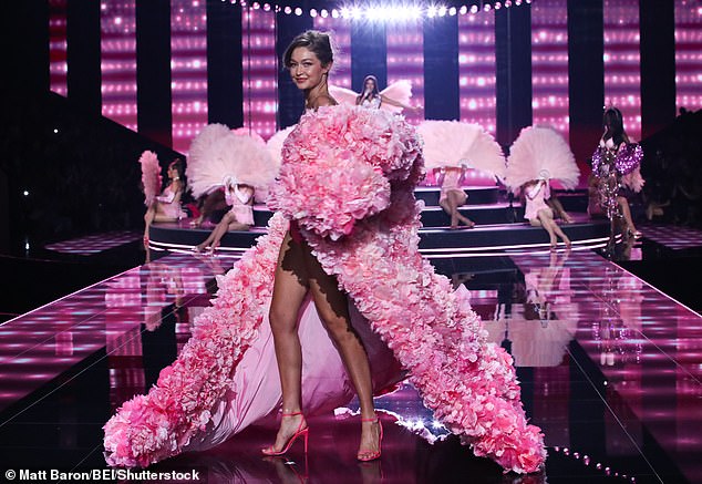 She covered up with a sheer pink robe that was lined with voluminous pink flowers