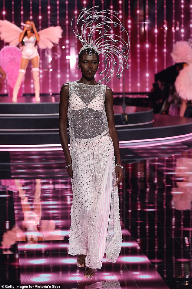 Awar Odhiang also wore a sheer bead-covered dress, but she covered up more with white-and-pink striped pajama pants and a white bra. She rocked a crap decorated with shooting star designs