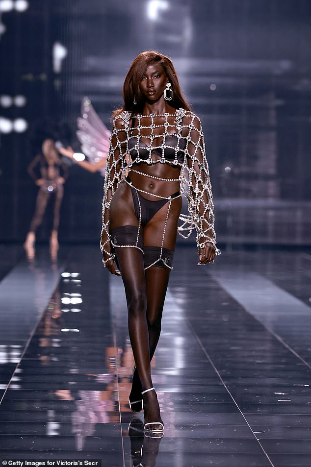 Anok Yai was decked out in black lingerie, and she covered up her sleek figure with a net-like jeweled top