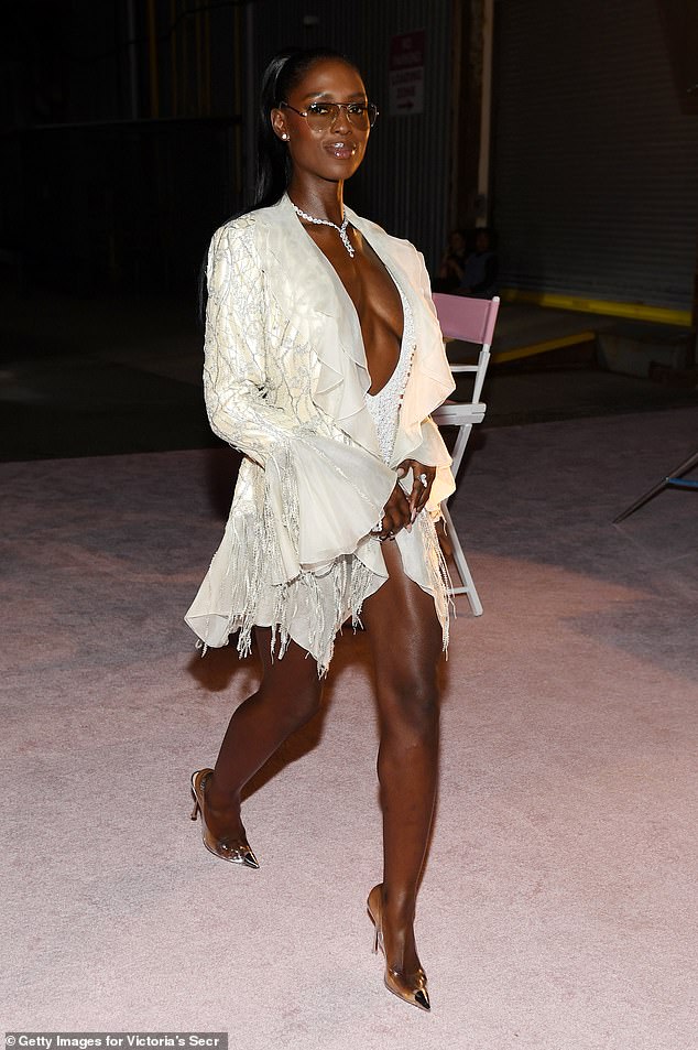 Jodie Turner-Smith put on a busty display in a plunging white outfit backstage