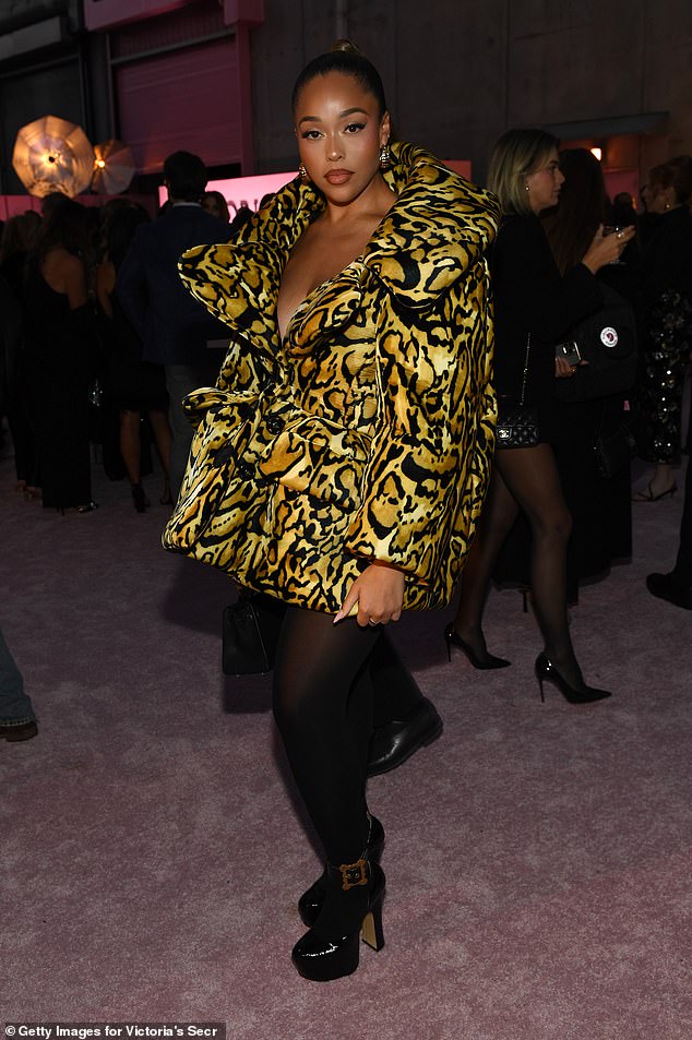 Kylie Jenner's pal Jordyn Woods looked fierce in a puffy animal-print jacket with black platform heels