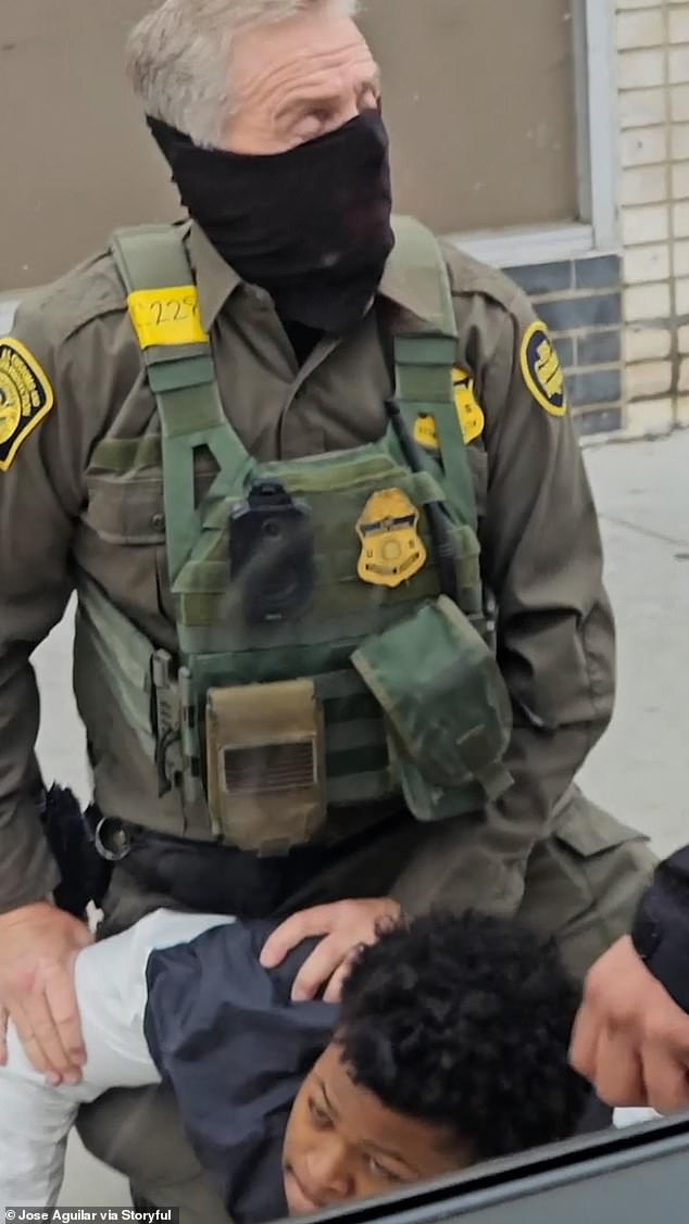 Warren King (pictured, bottom) said he was held in an ICE truck for several hours