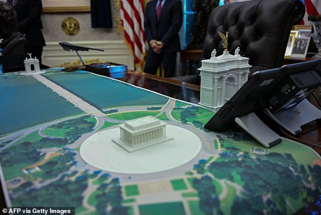 The president also showcased the design plans for the arch on his desk in the Oval Office in front of reporters