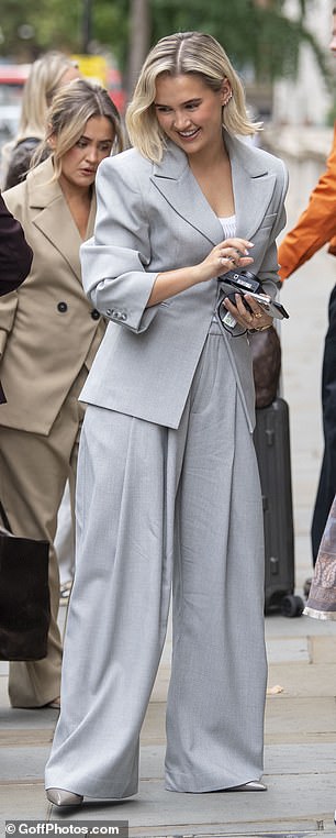 Molly-Mae paired the blazer oversized barrel-leg trousers and a pair of nude patent stilettos
