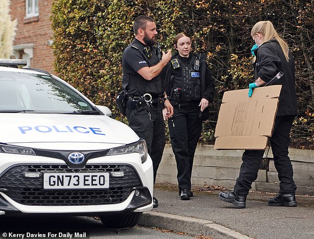 Police outside the home of Mr Williams in a leafy cul-de-sac in Kent