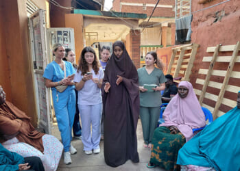 Nutrition students provide instruction to Somalian refugees in Uganda.