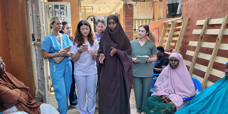 Nutrition students provide instruction to Somalian refugees in Uganda.