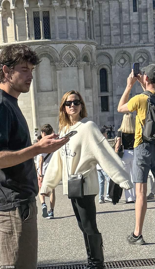 Dressed in leggings and with a jumper around her waist, the Harry Potter star was pictured with Kevitch, 34, as they visited the Leaning Tower of Pisa