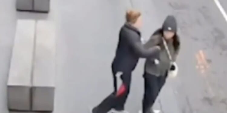 Terrifying moment woman is stabbed by stranger while she walks to work as CCTV vid captures horrific unprovoked attack