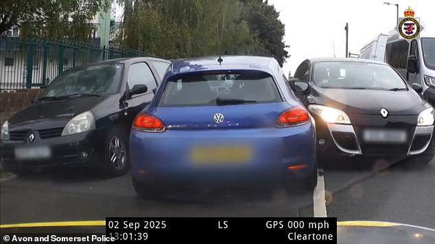 The vehicle eventually became jammed between two cars (pictured), which he had tried to bash through and past, in the Fishponds area of the city