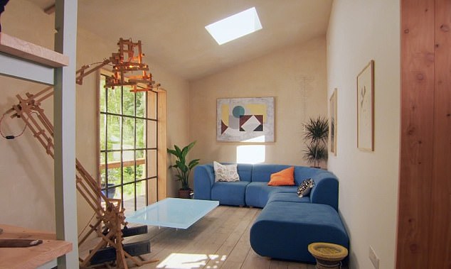 The living room, featuring recycled windows, was no less modern than the kitchen