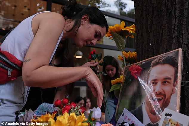 Hundreds of admirers brought flowers, candles, and posters to the site where Payne passed away in 2024