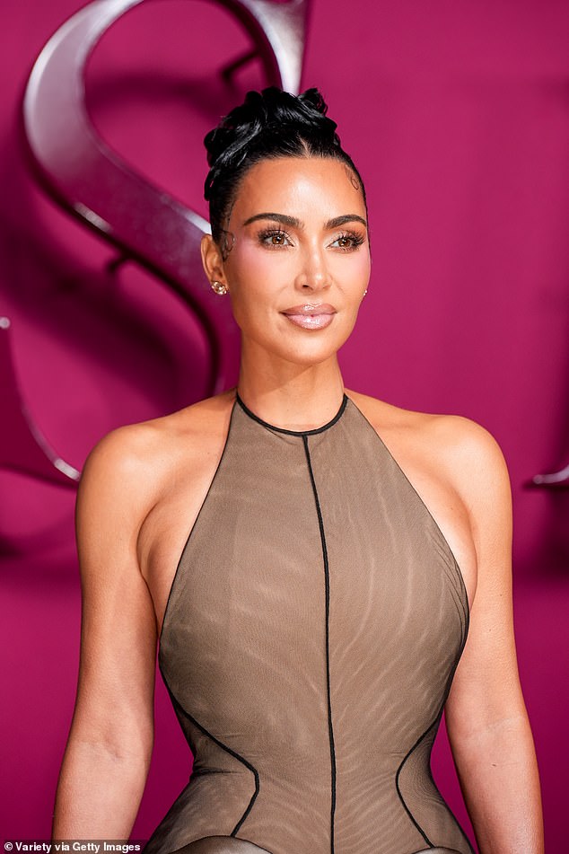 Her raven hair was pulled into a chic updo, highlighting her face, which featured perfect glam