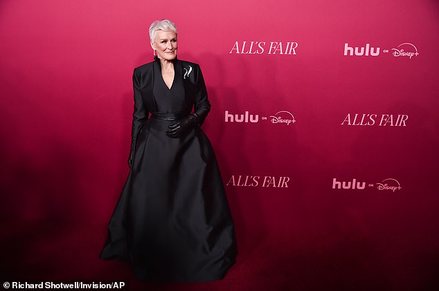 The Fatal Attraction star accessorized with a sparkling brooch