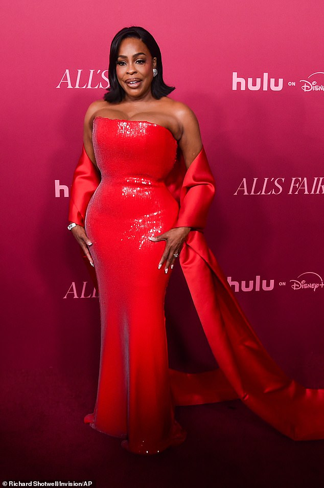 Niecy was a vision in a Jessica Rabbit style red dress
