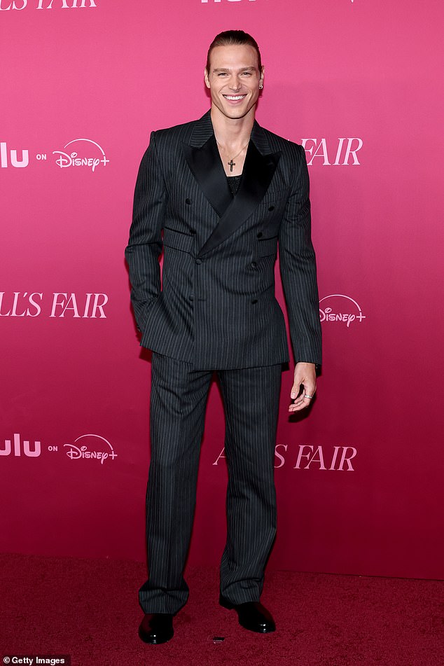 Kim's hunky onscreen husband Matthew Noszka, 32 ¿ who is a model ¿ looked dapper in a striped suit