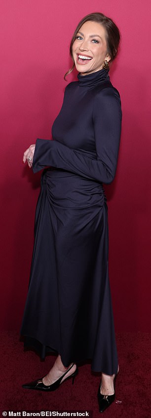 She completed the outfit with black pointed toe heels