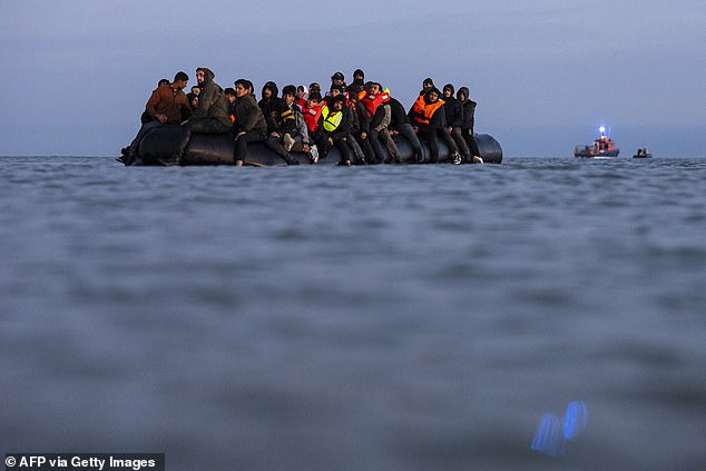 The migrant arrived in the UK on a small boat (file photograph of migrants in the Channel)